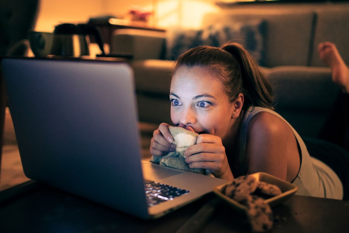 A picture of someone excited to watch something.