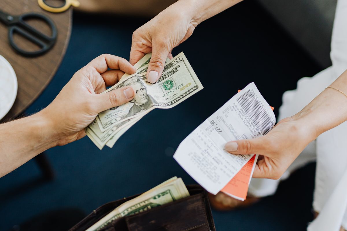 A picture of someone paying something.