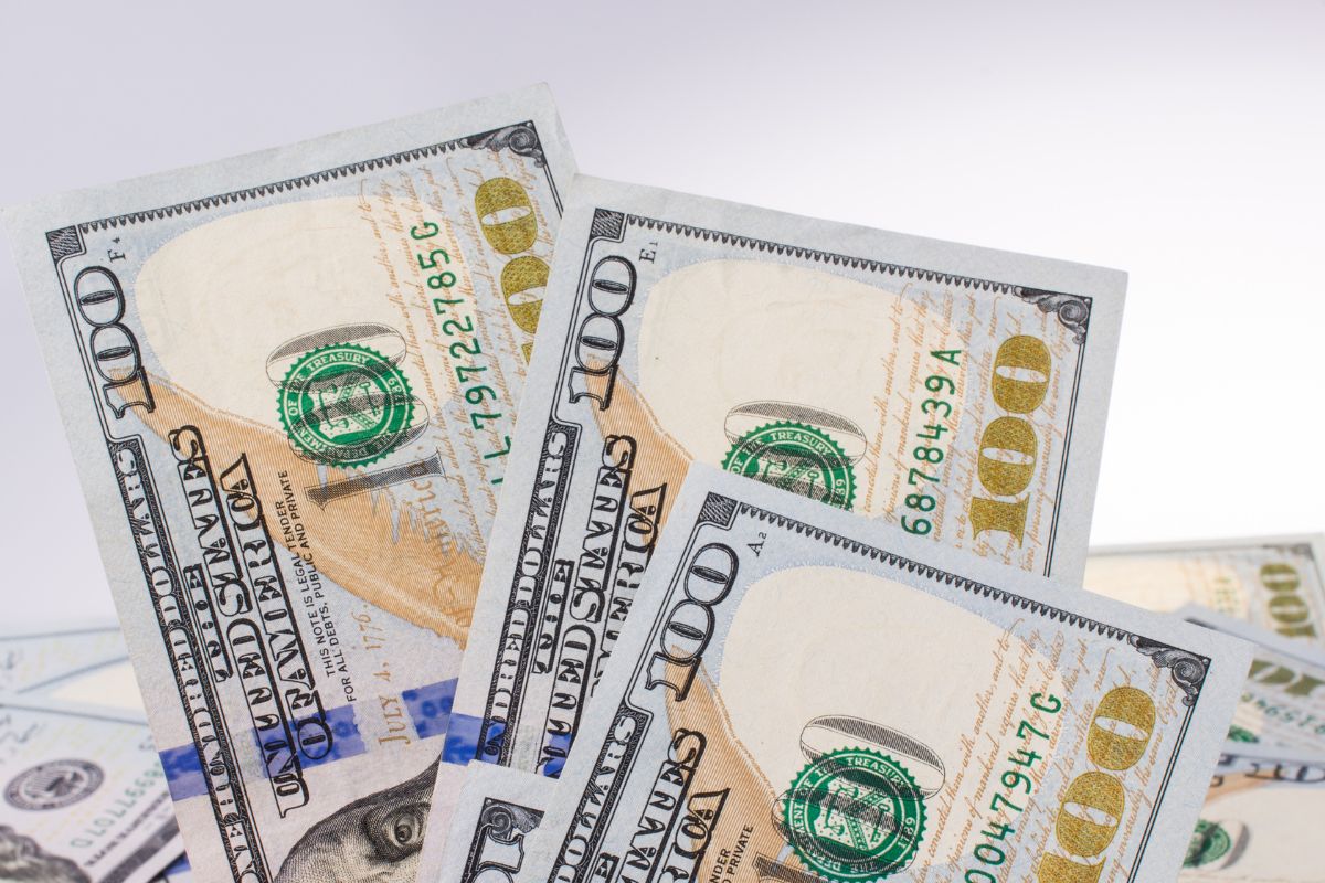 A picture of 3 $100 bills.