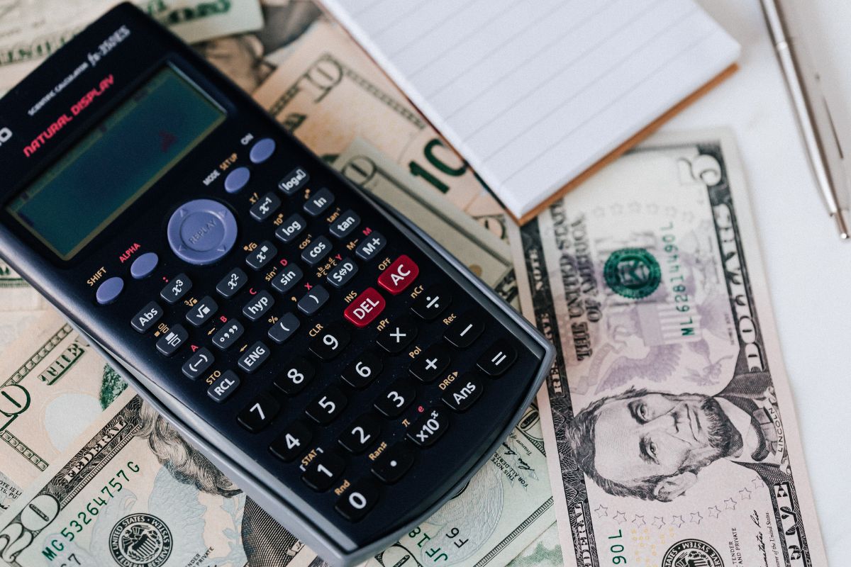 A picture of dollar bills and a calculator.