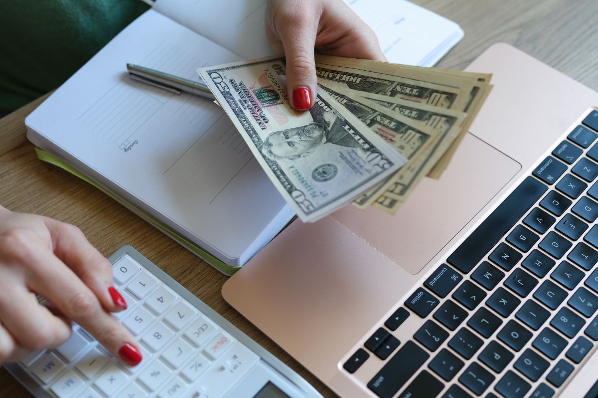A picture of someone counting money.