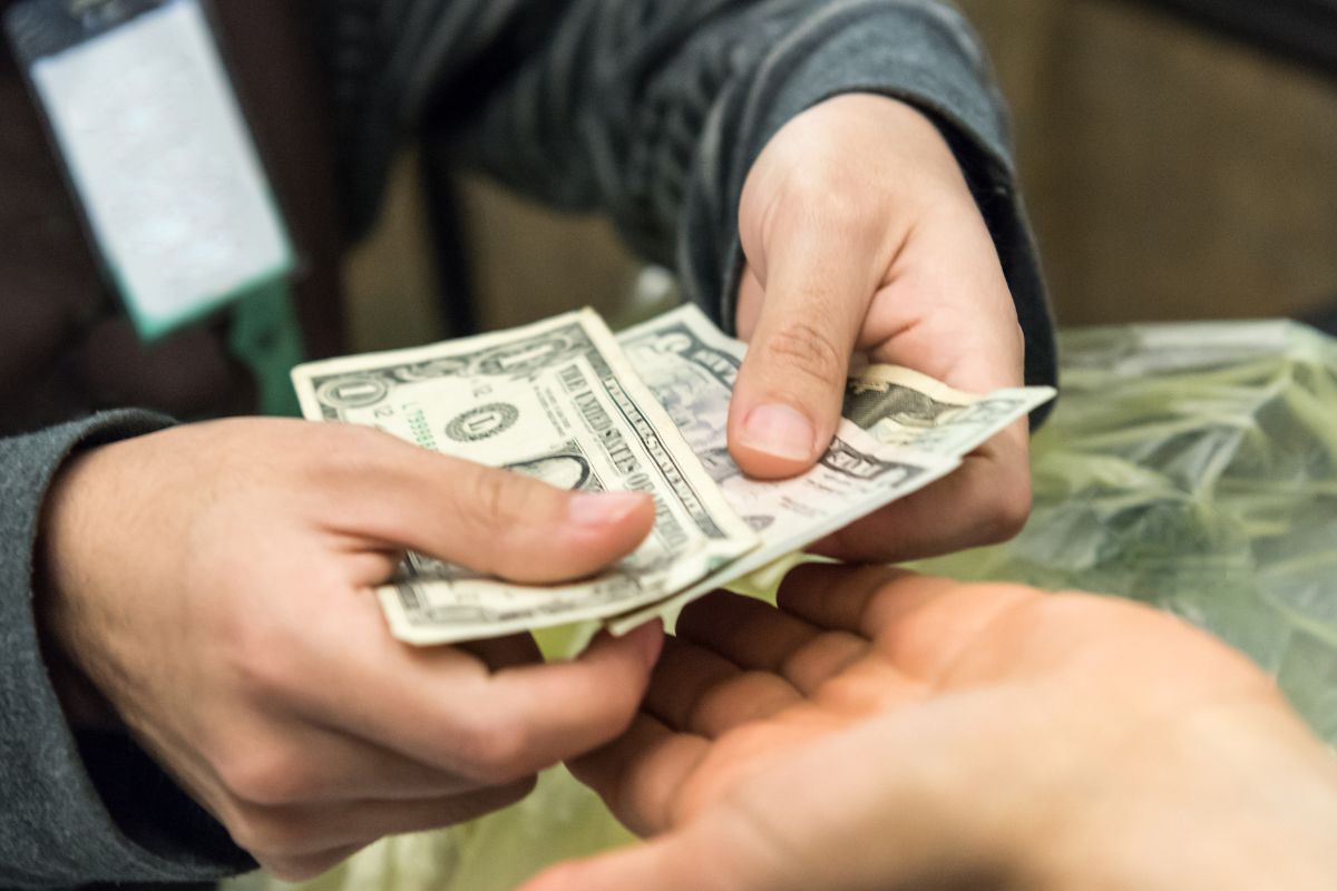 A picture of someone counting change.