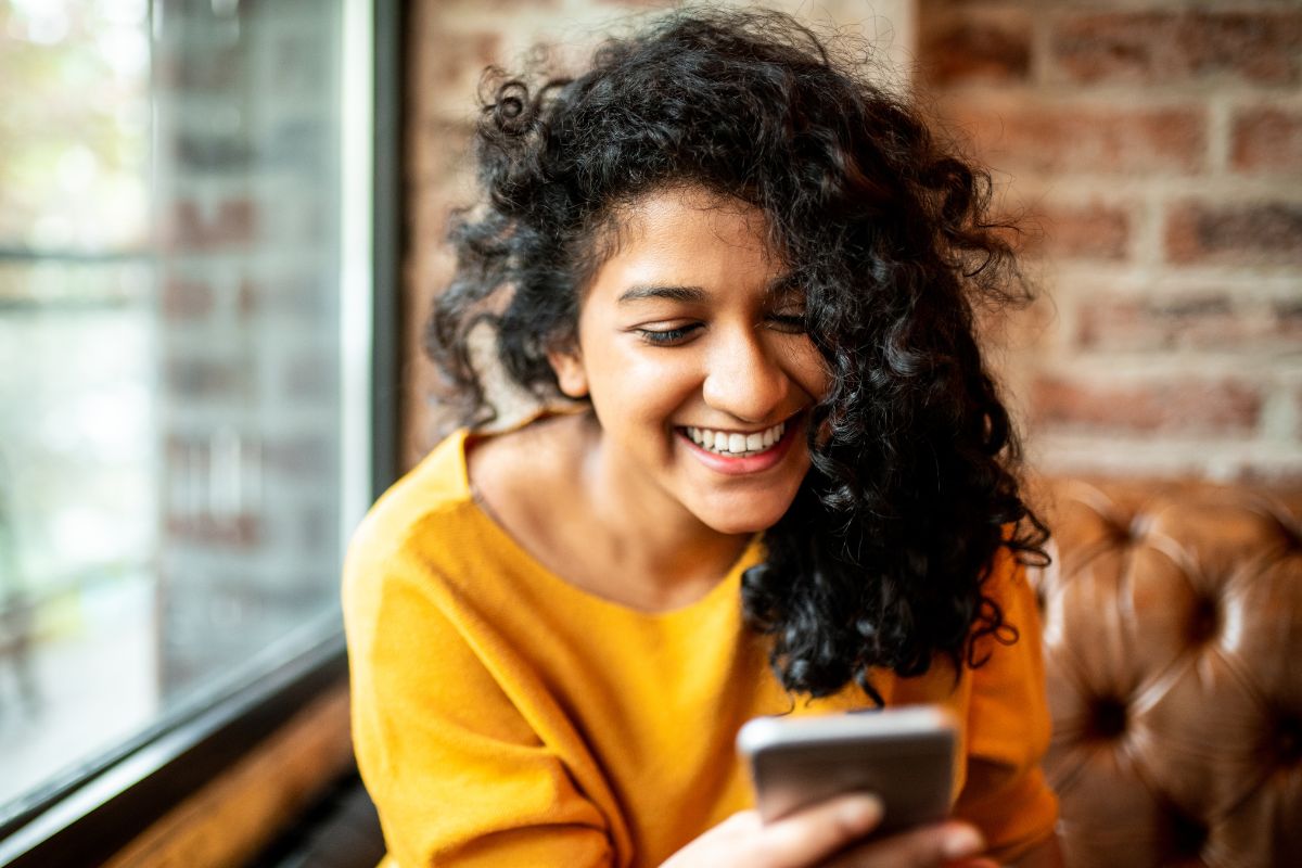 A picture of someone using their phone.