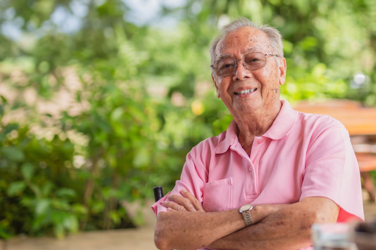 A picture of an elderly man smiling.