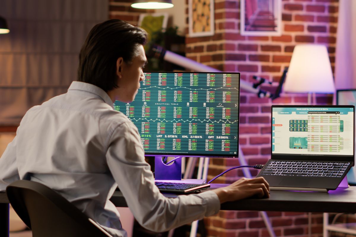 A picture of someone looking at stock prices.