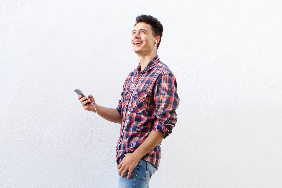 A picture of someone happily walking.