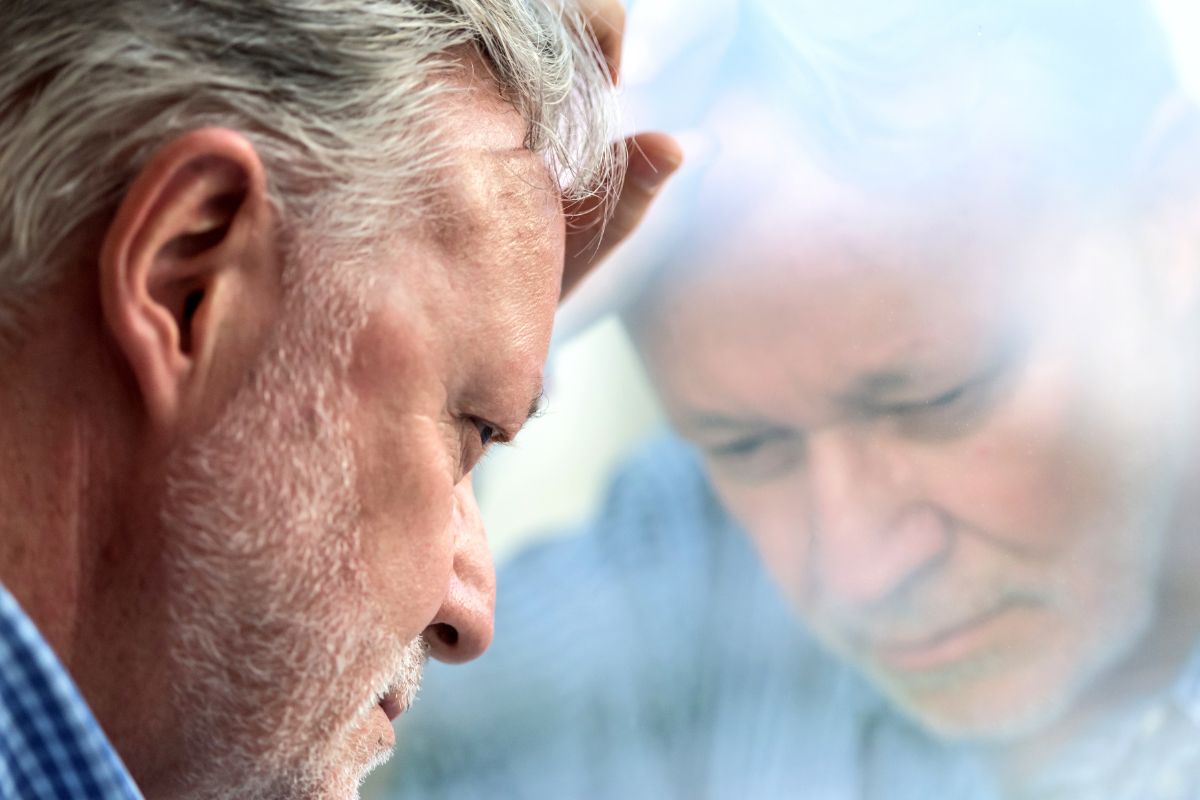 A picture of a sad senior citizen.