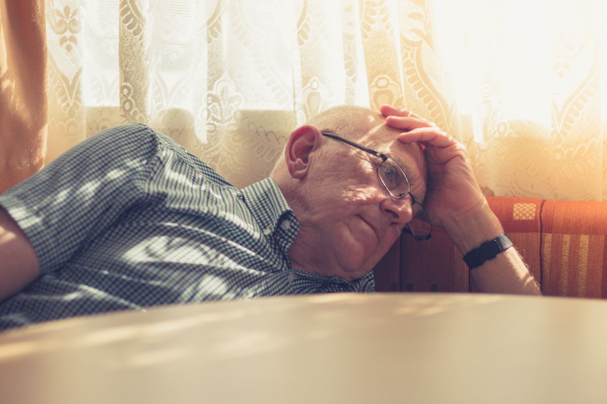 A picture of a sad senior citizen.