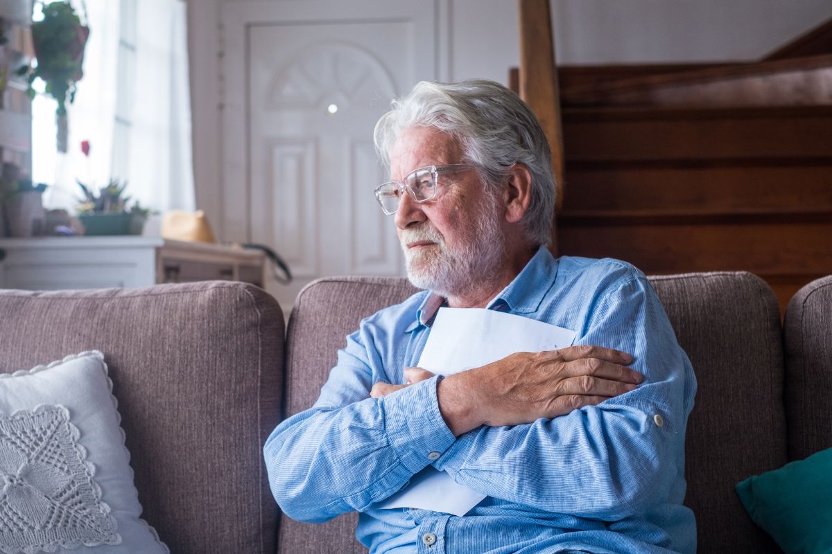 A picture of a sad senior citizen.