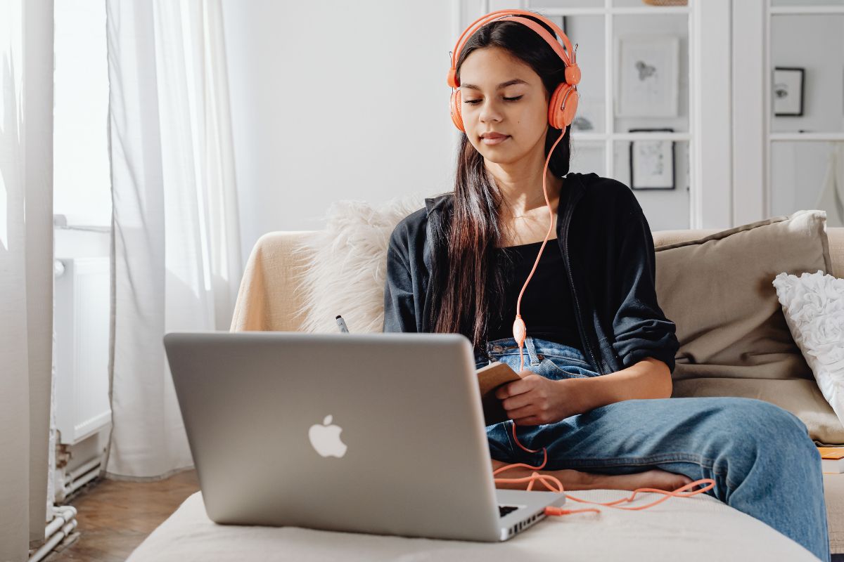 A picture of a teen using her laptop.