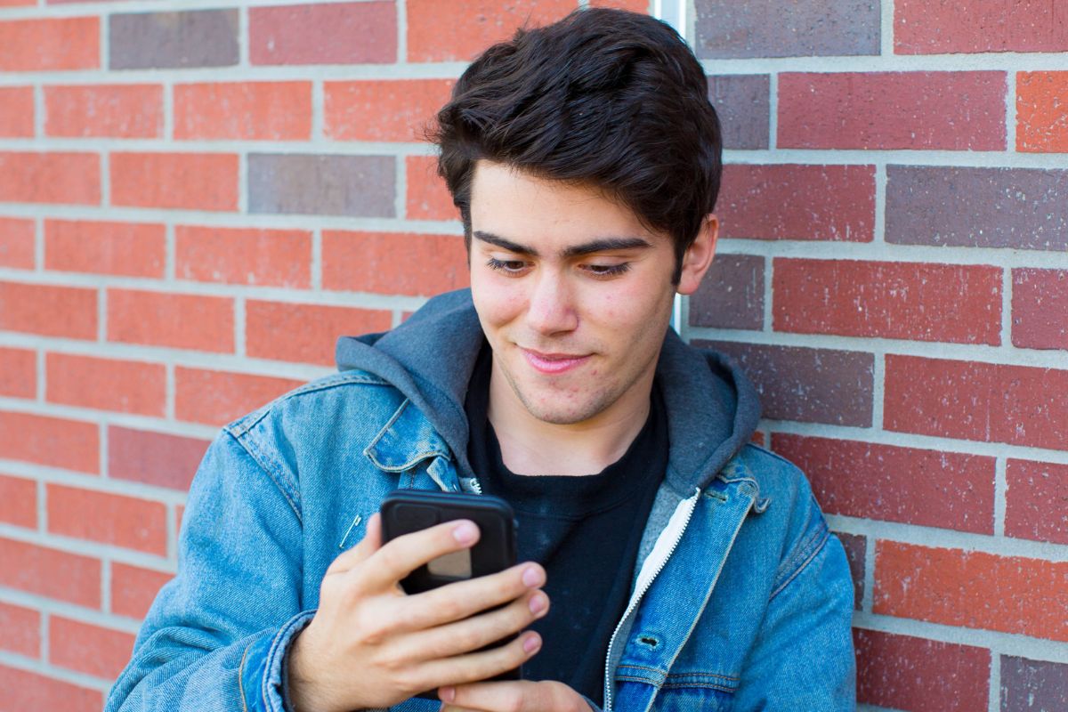 A picture of someone using their phone.