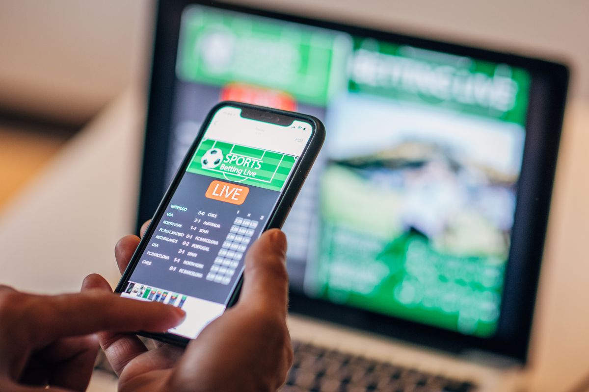 A picture of someone doing sports gambling.