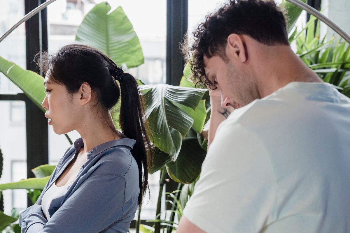 A picture of a couple ignoring each other.