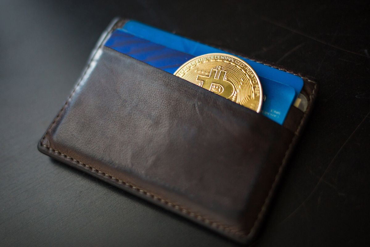 A picture of a Bitcoin token (for representation) in a wallet.
