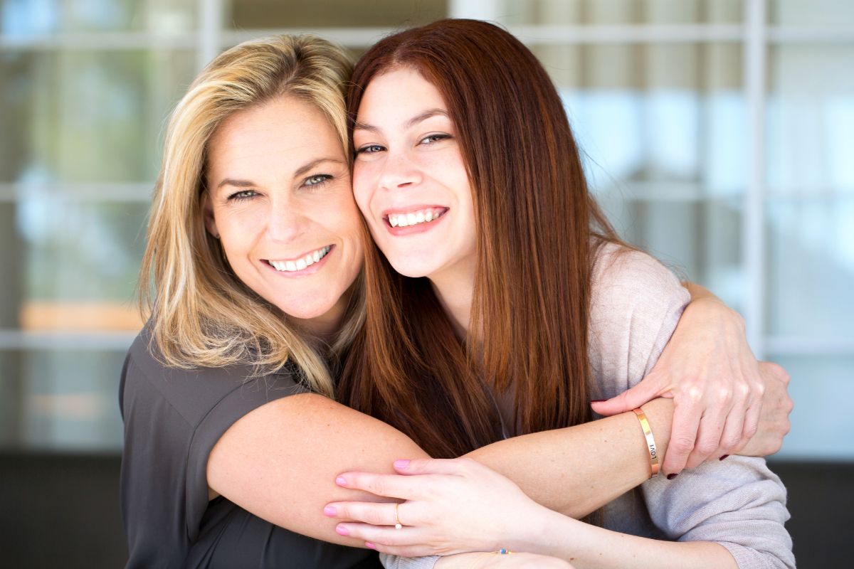 A picture of a mother and her child embracing.