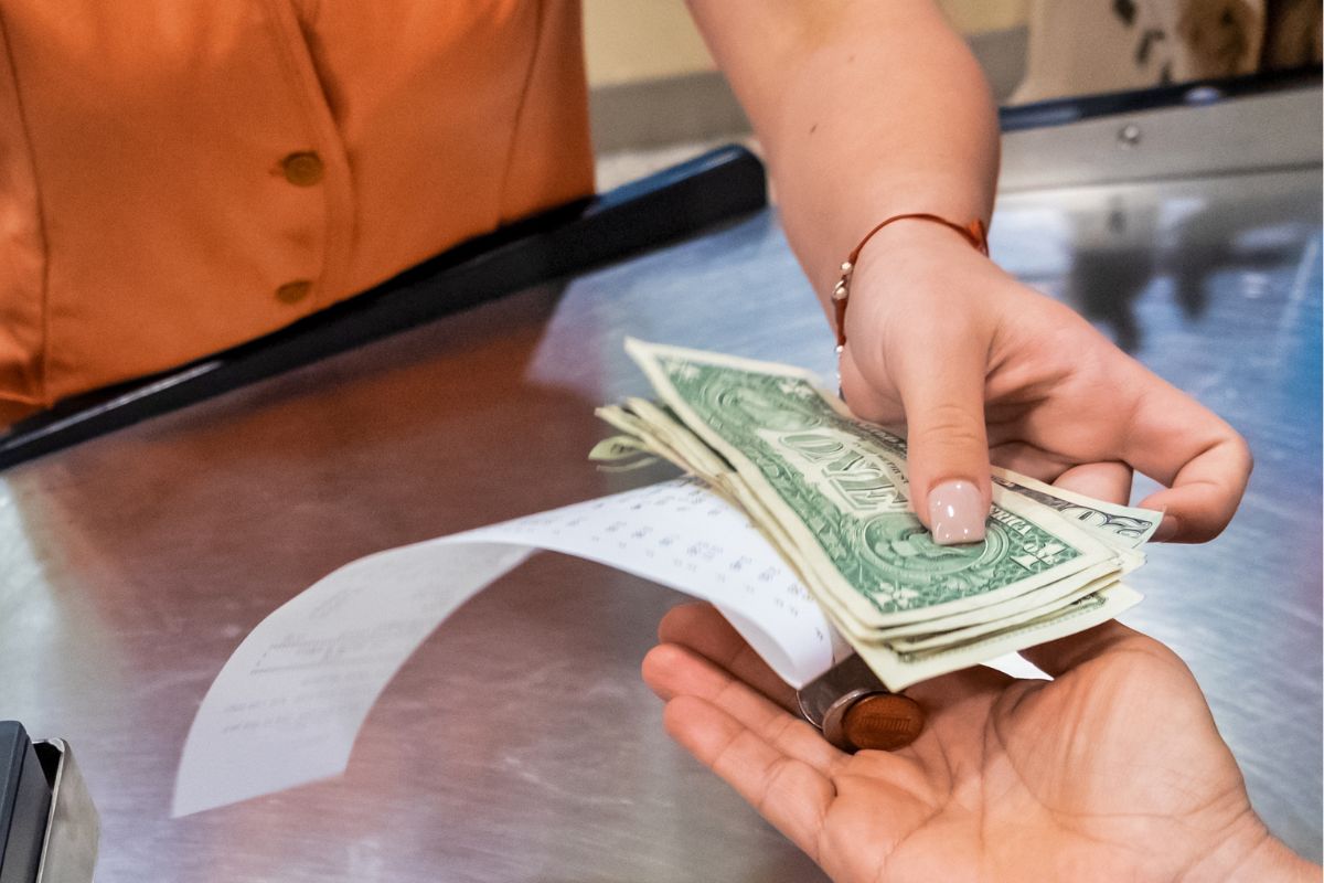 An image shows using cash for daily spending.