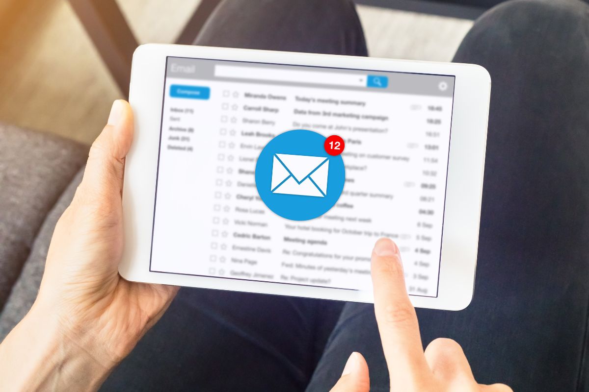 A picture shows a woman's hand unsubscribing from retail emails.