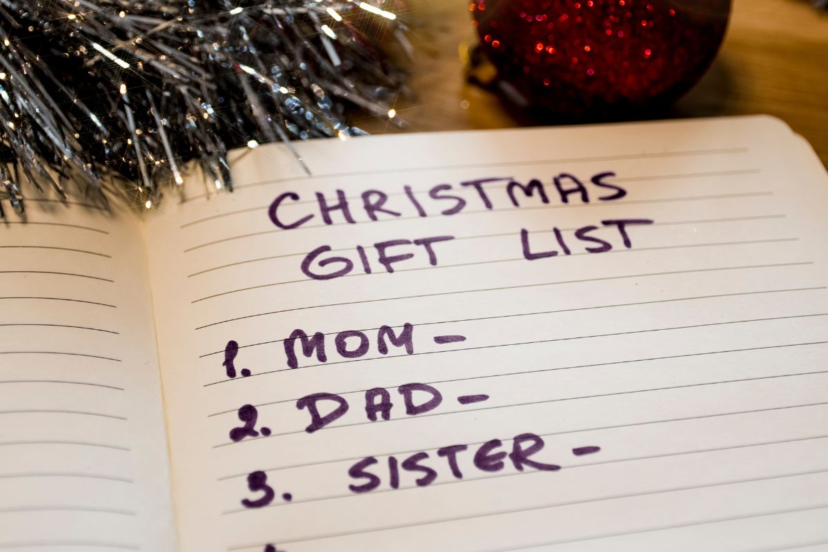 An image of a notebook with a gift list.