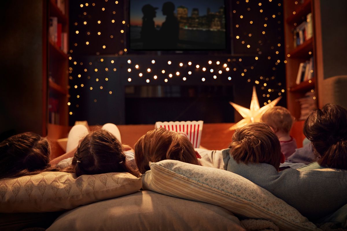 An image shows a family watching a movie.