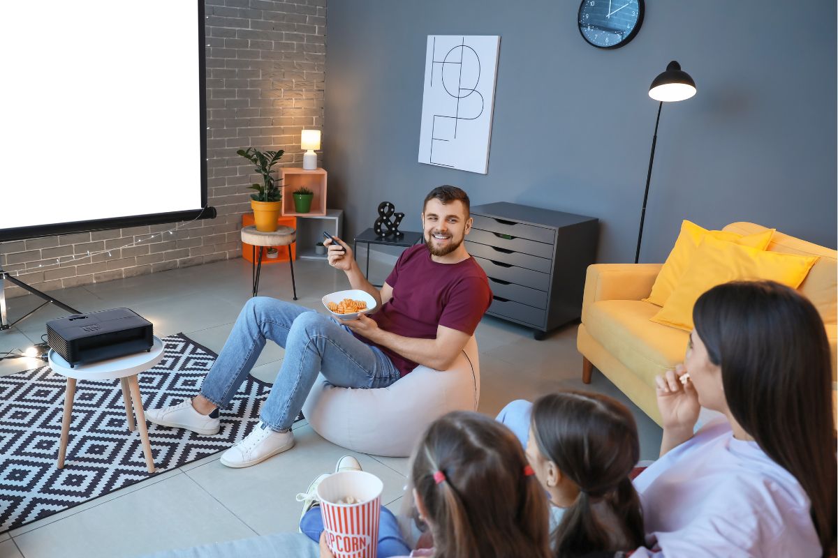 An image shows a family watching a movie.