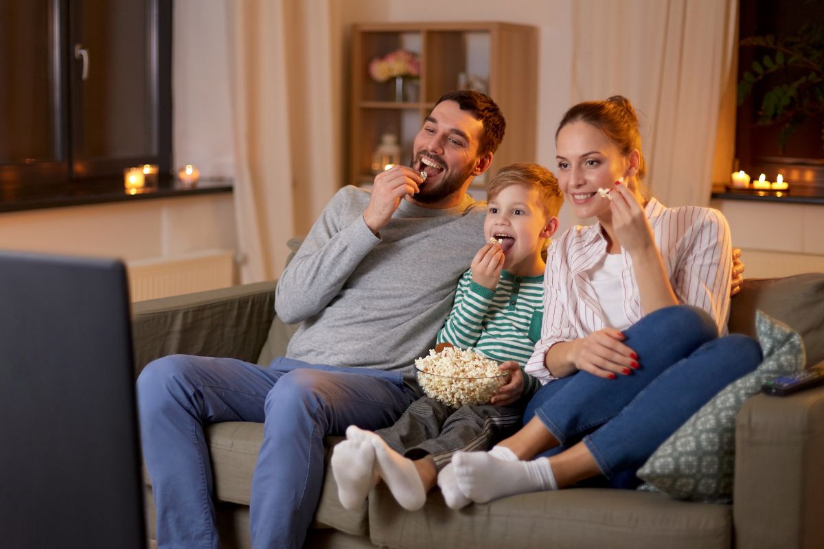 The picture shows a family enjoying the movie.