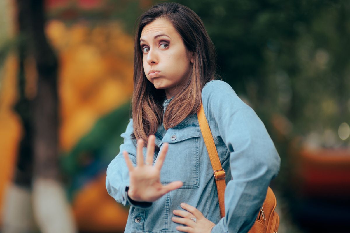 A picture shows a woman making a no gesture.