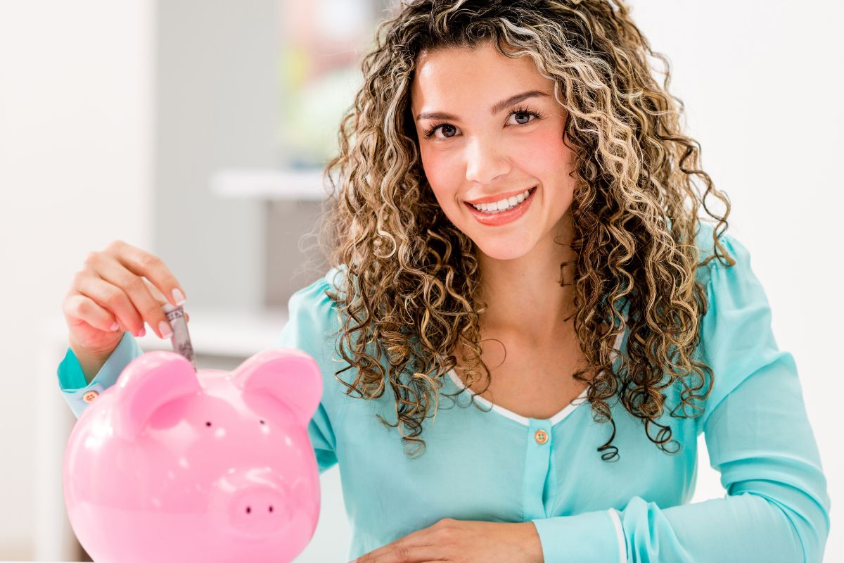 An image shows a woman saving money.