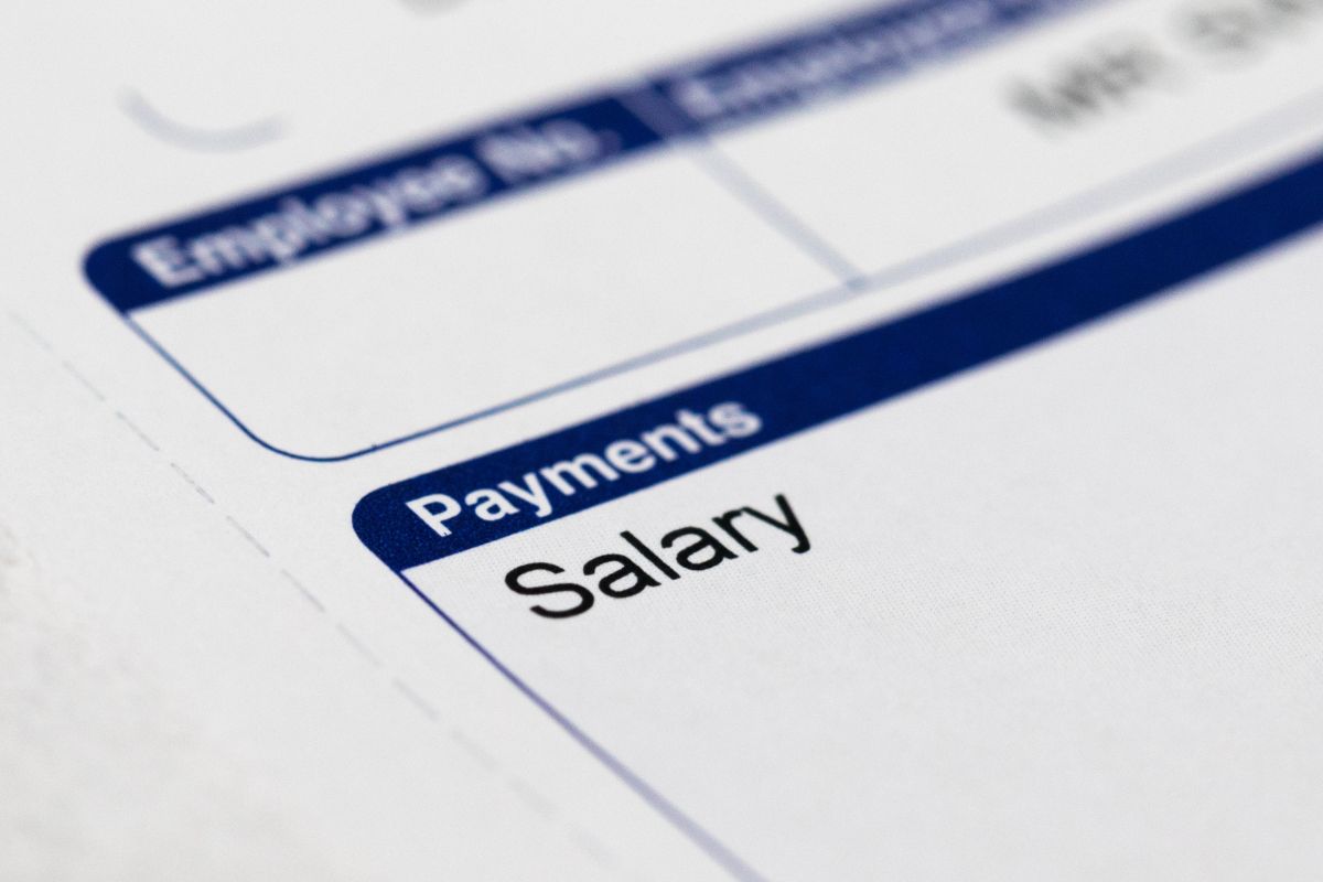 An image shows a salary paycheck.