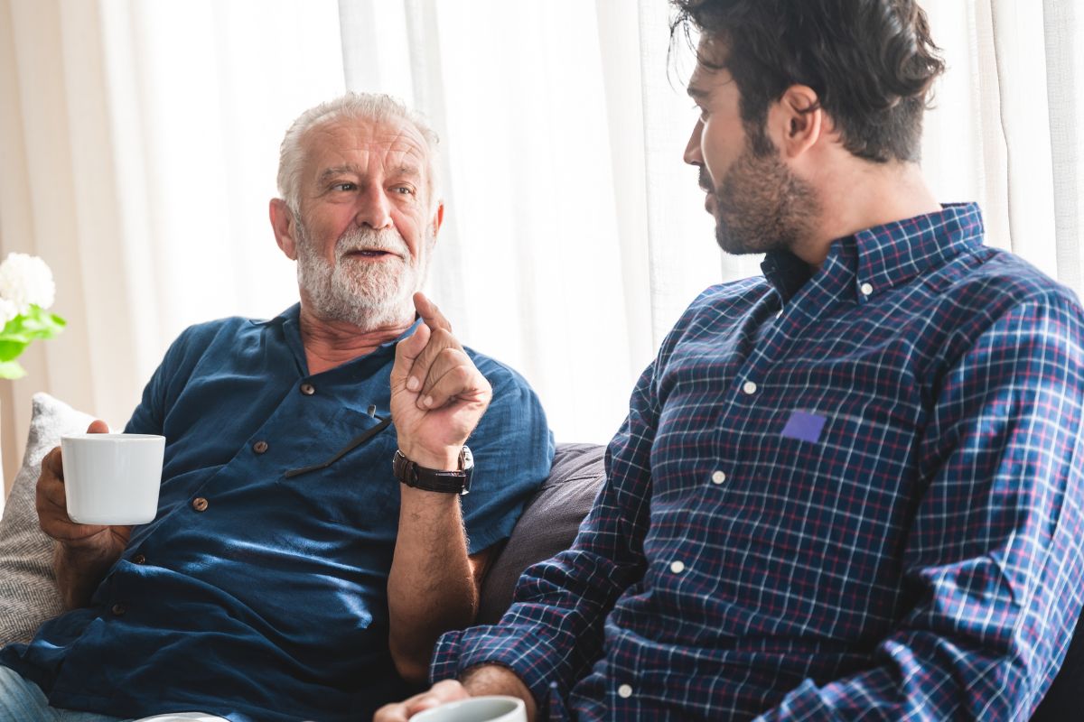 A picture shows a father and son talking.