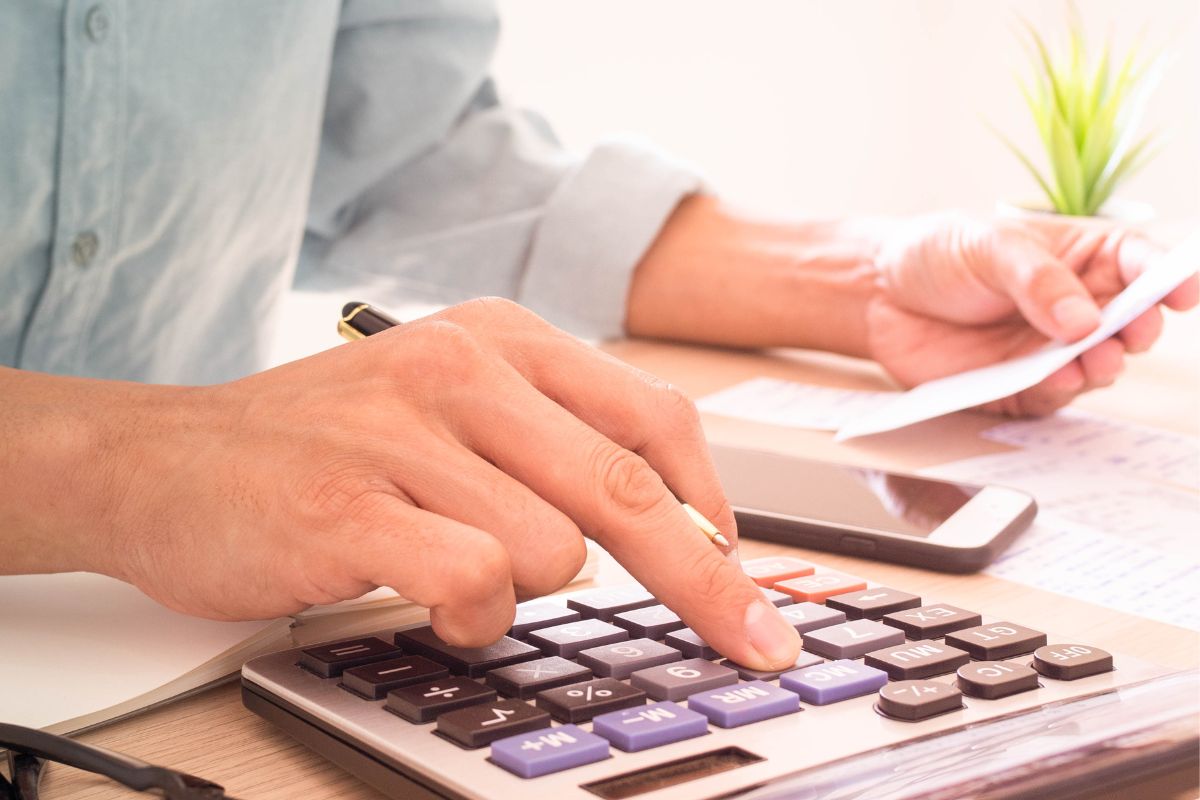 A picture shows a man calculating.