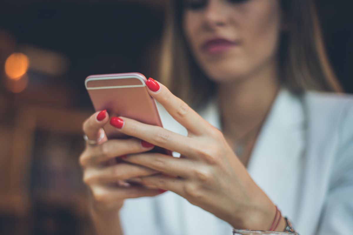 An image of a woman using a phone.
