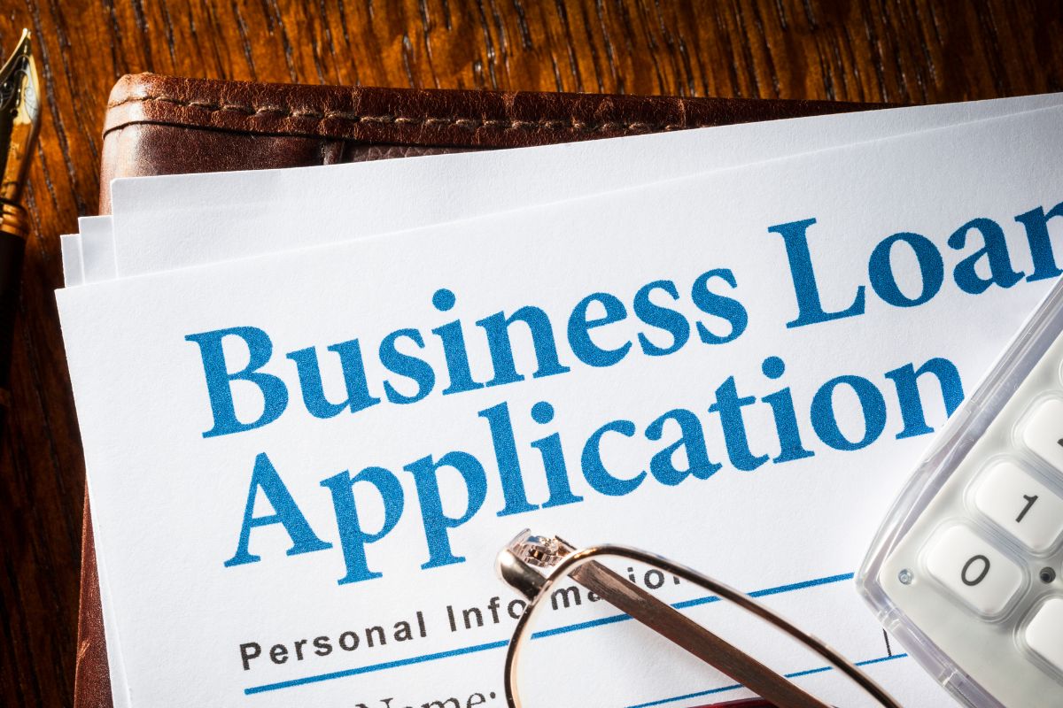 A picture shows a business loan application form.