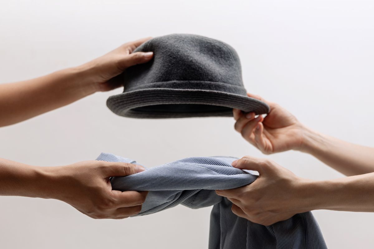 An image shows two women swapping stuff.