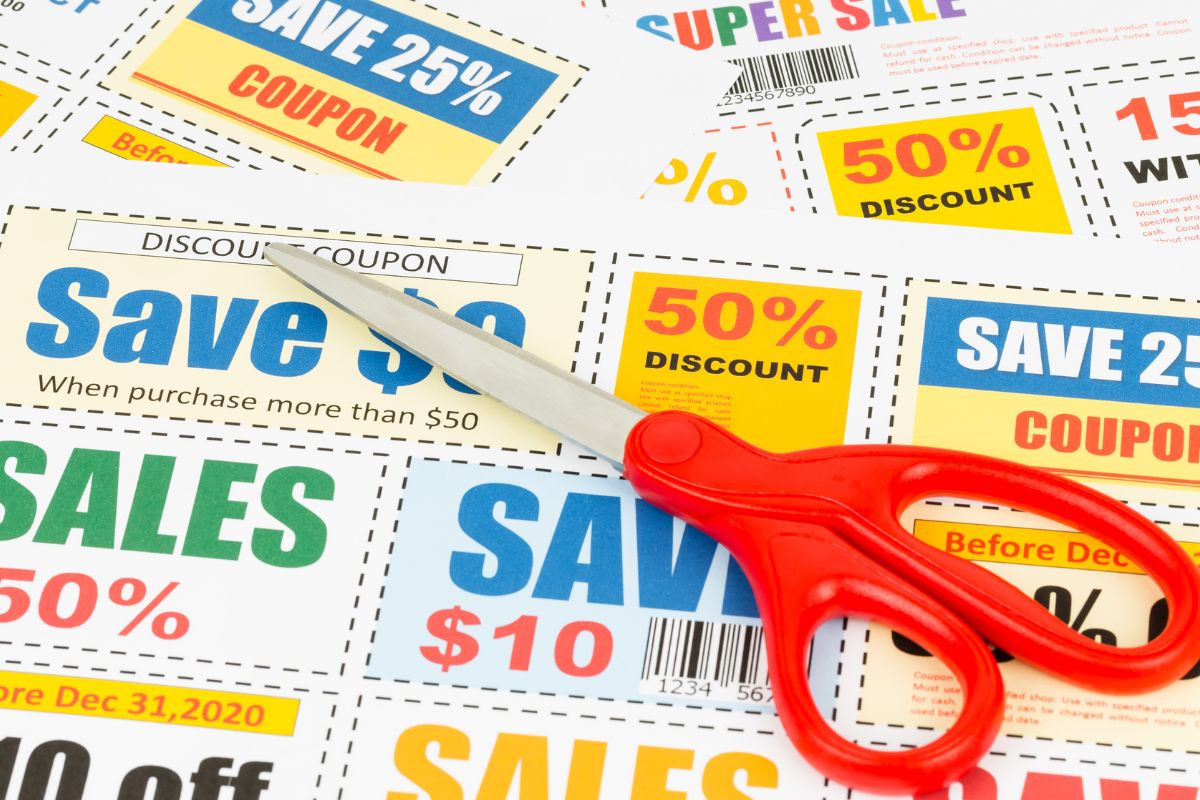 A picture of coupons and a pair of scissors.
