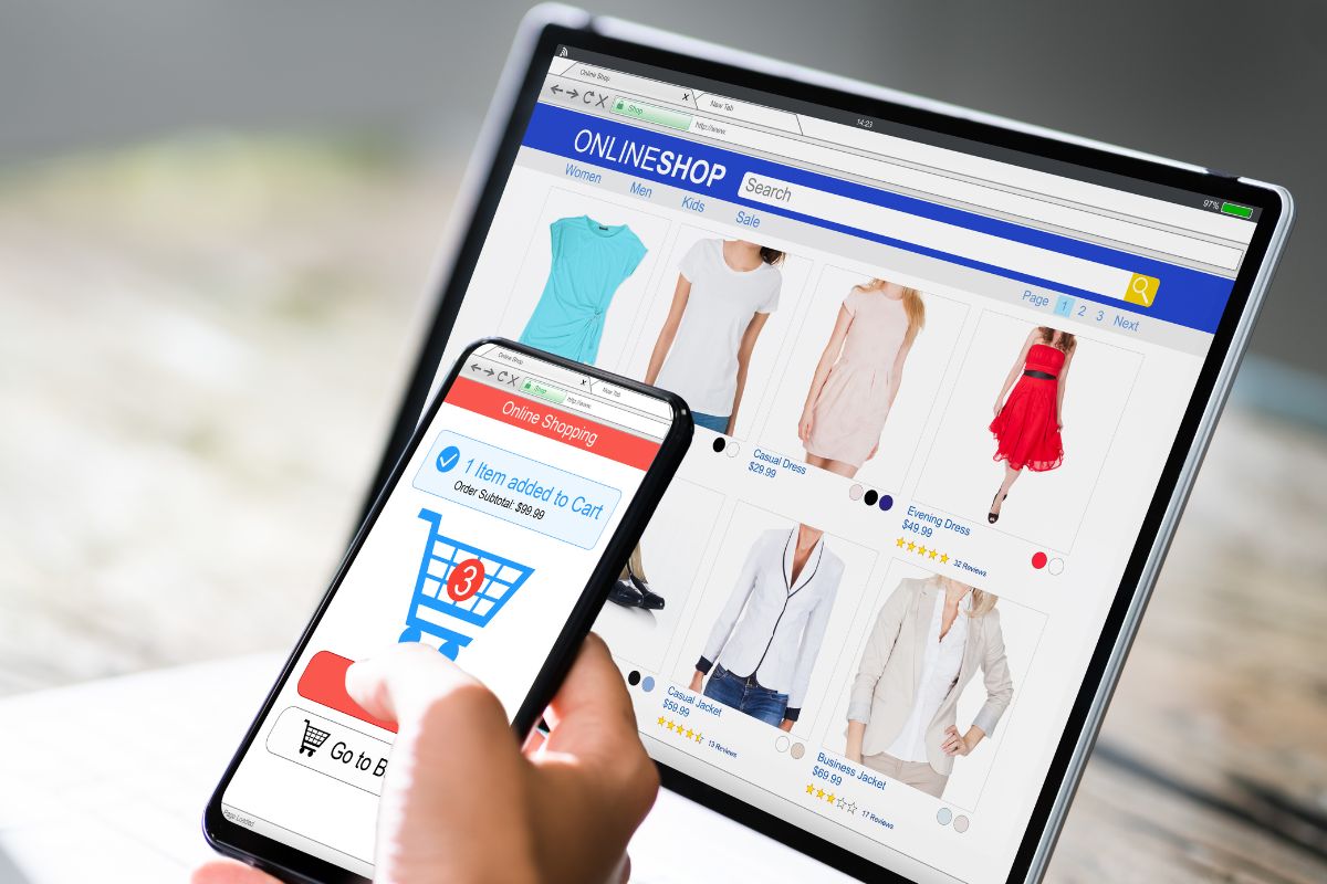 An image shows a lady's hand shopping online.