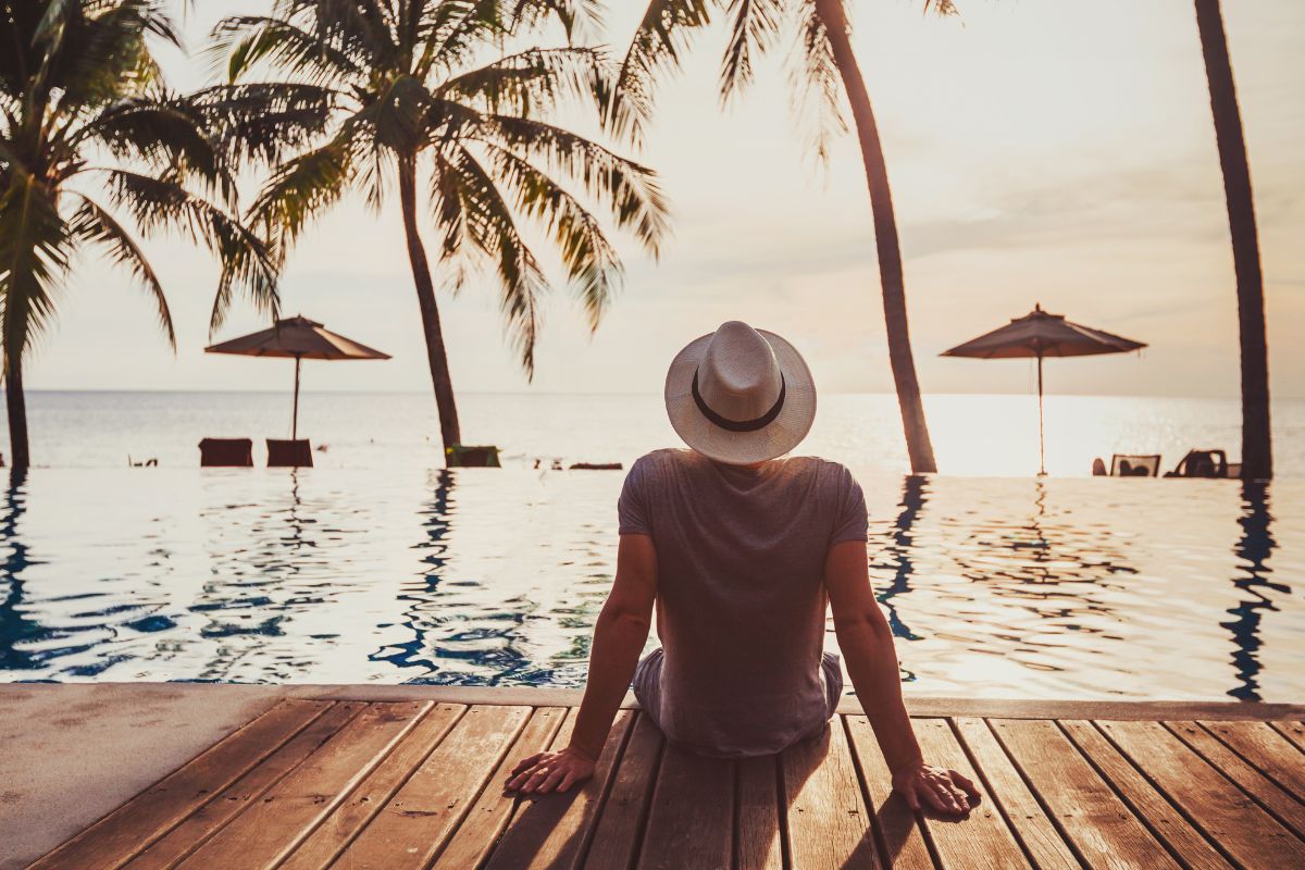 A picture shows a man enjoying his vacation.