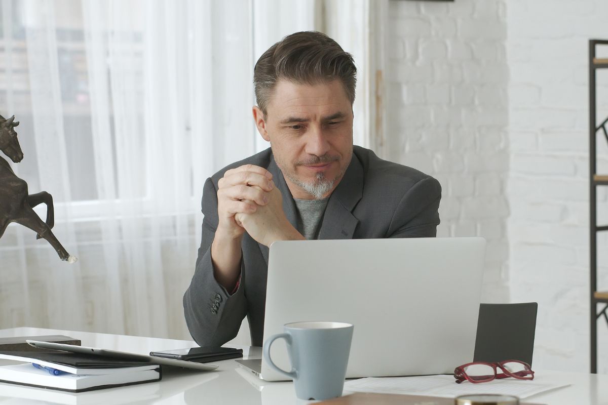 An image of a man working at the office.