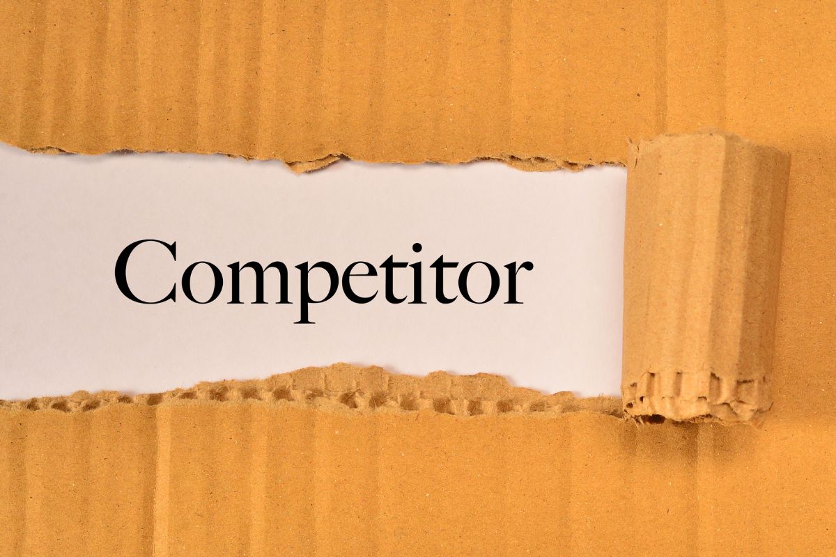 An image of torn paper with competitor wording.