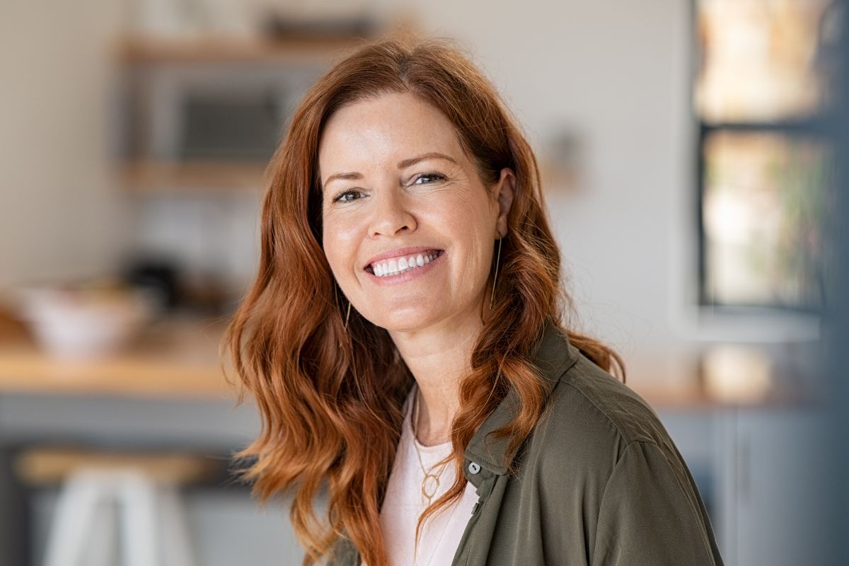 A picture shows a woman smiling.