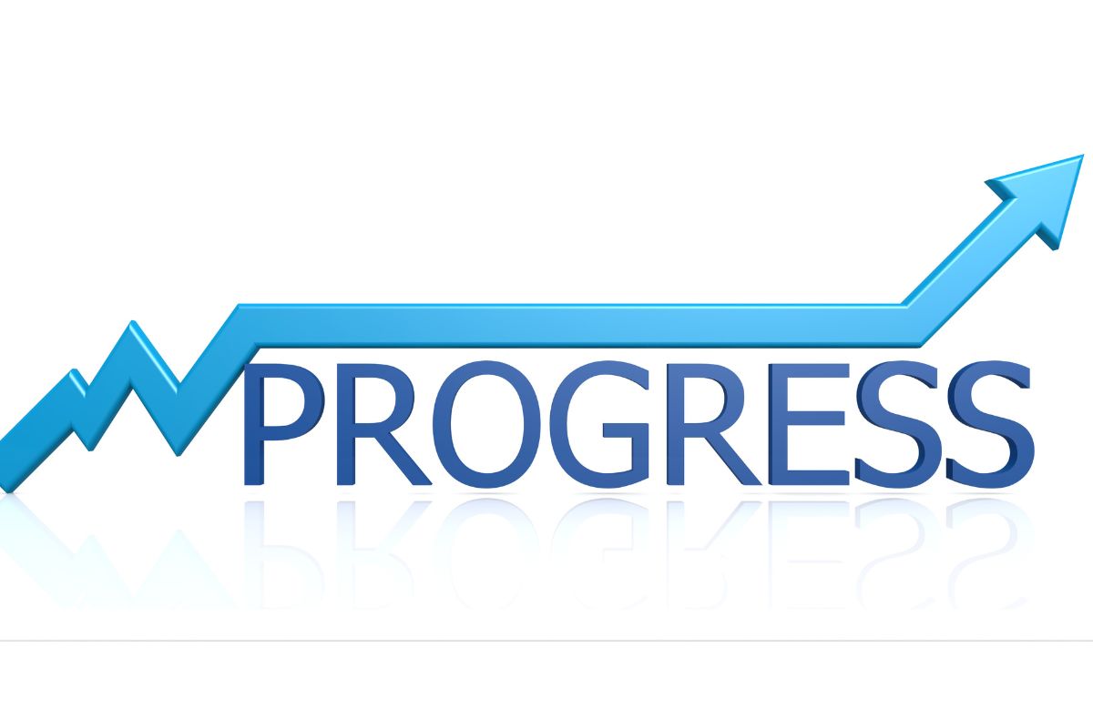A picture of the word progress and a rising arrow.