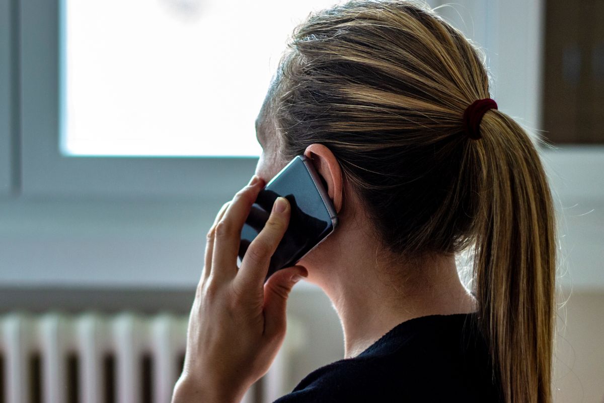 A picture shows a woman making a phone call.