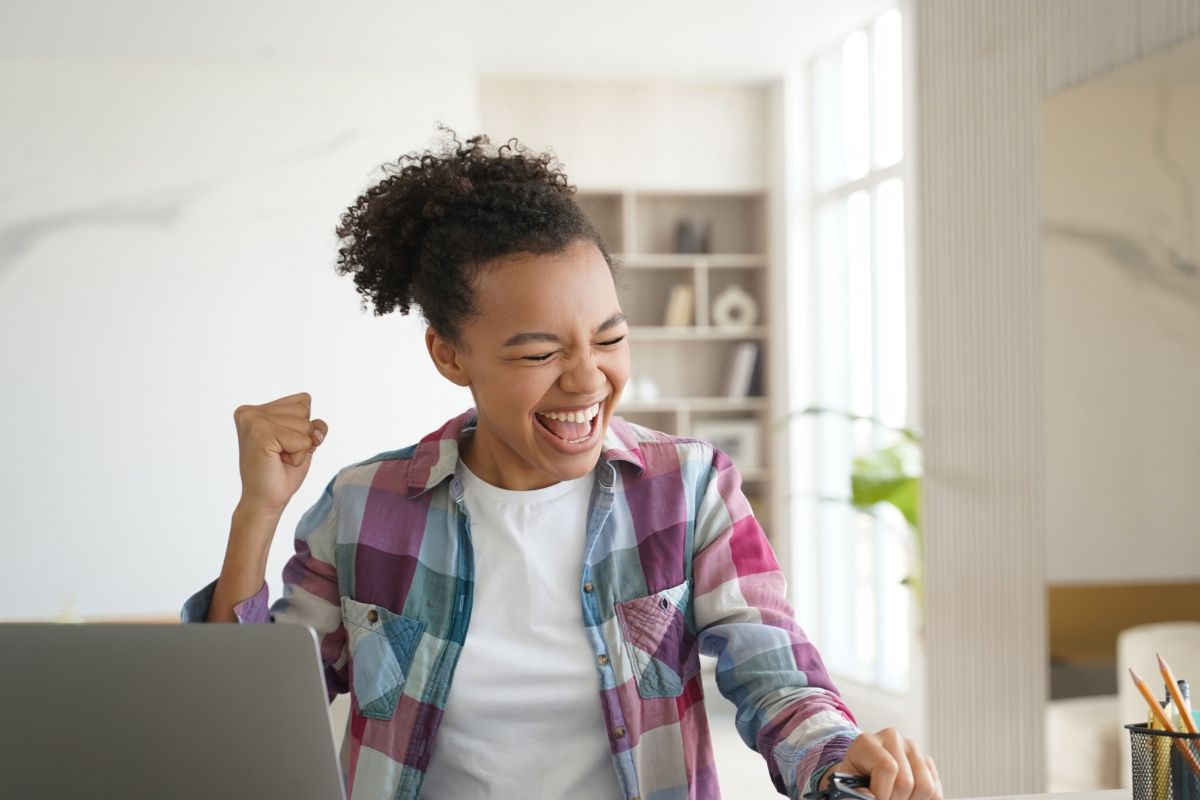 A picture of a teen celebrating.
