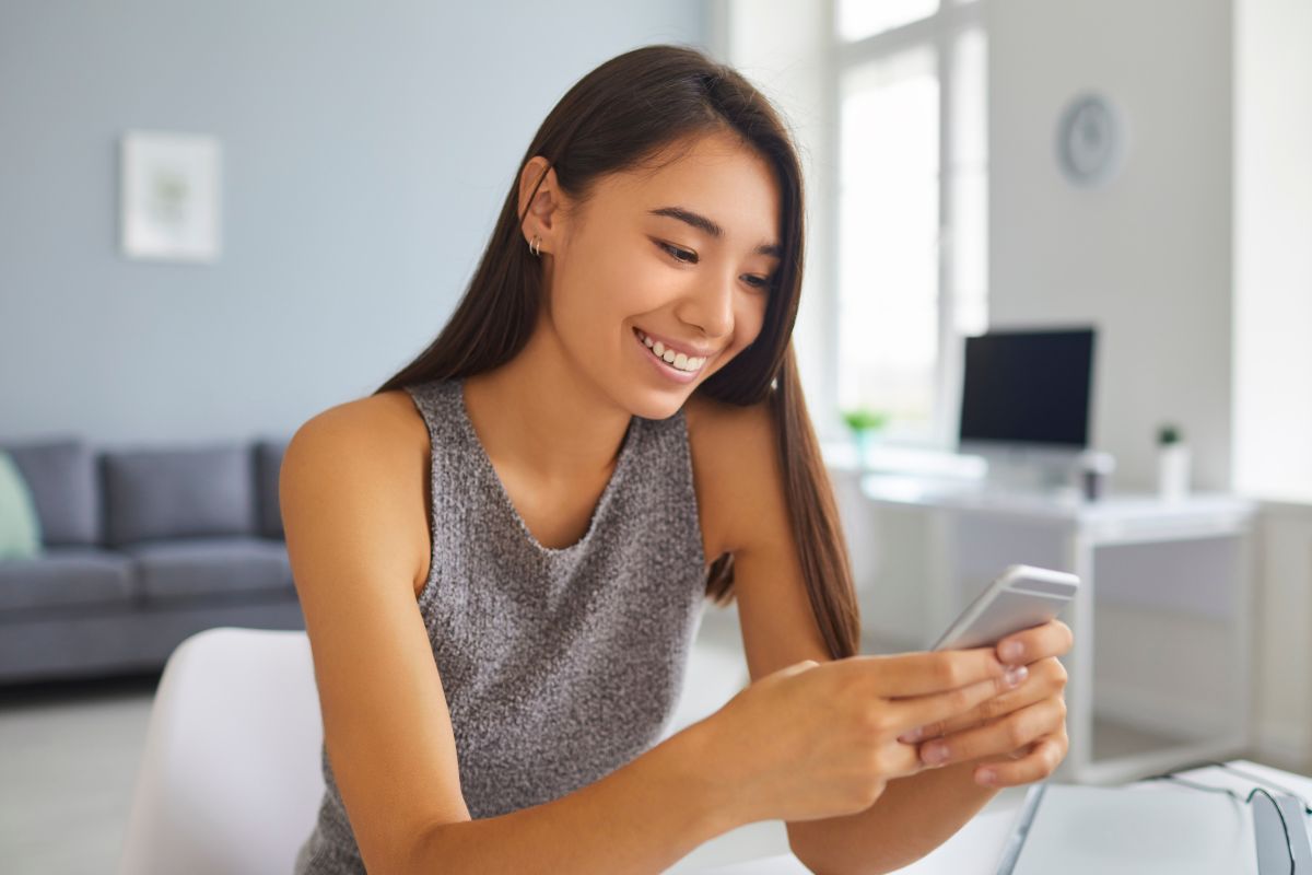 A picture of a teen texting.