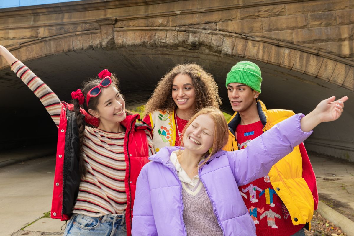 A picture of teens posing for a picture.