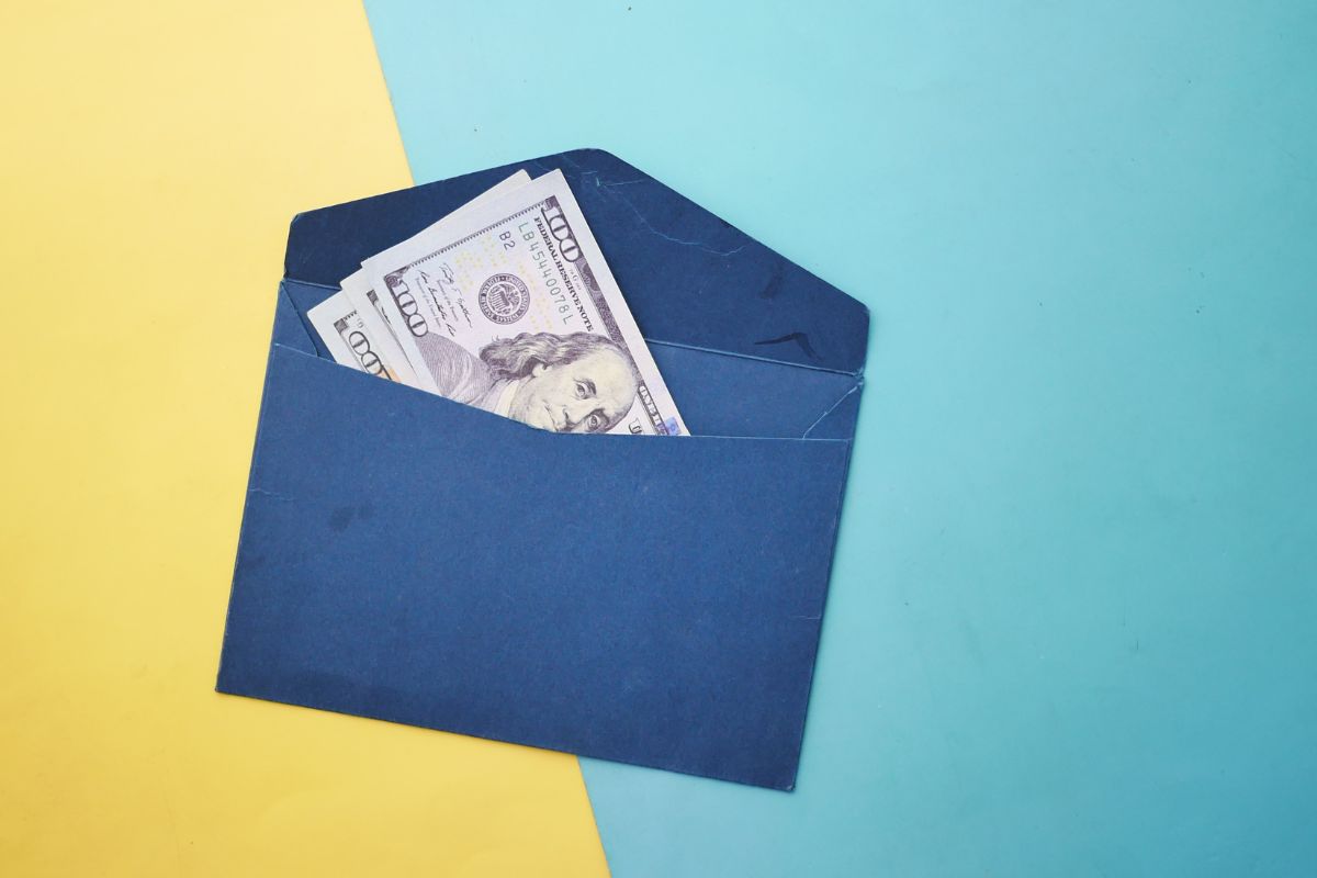 A picture of money inside an envelope.