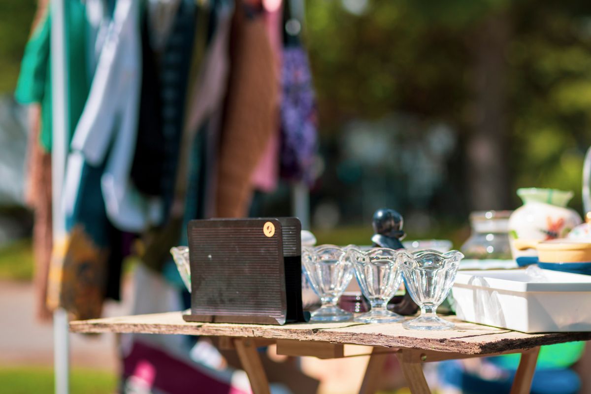 A picture of someone doing a garage sale.