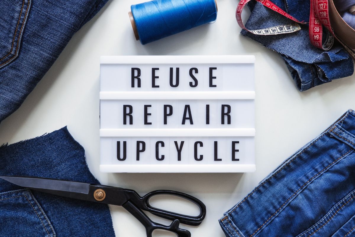 A picture of a sign of Reuse, Repair, Recycle.