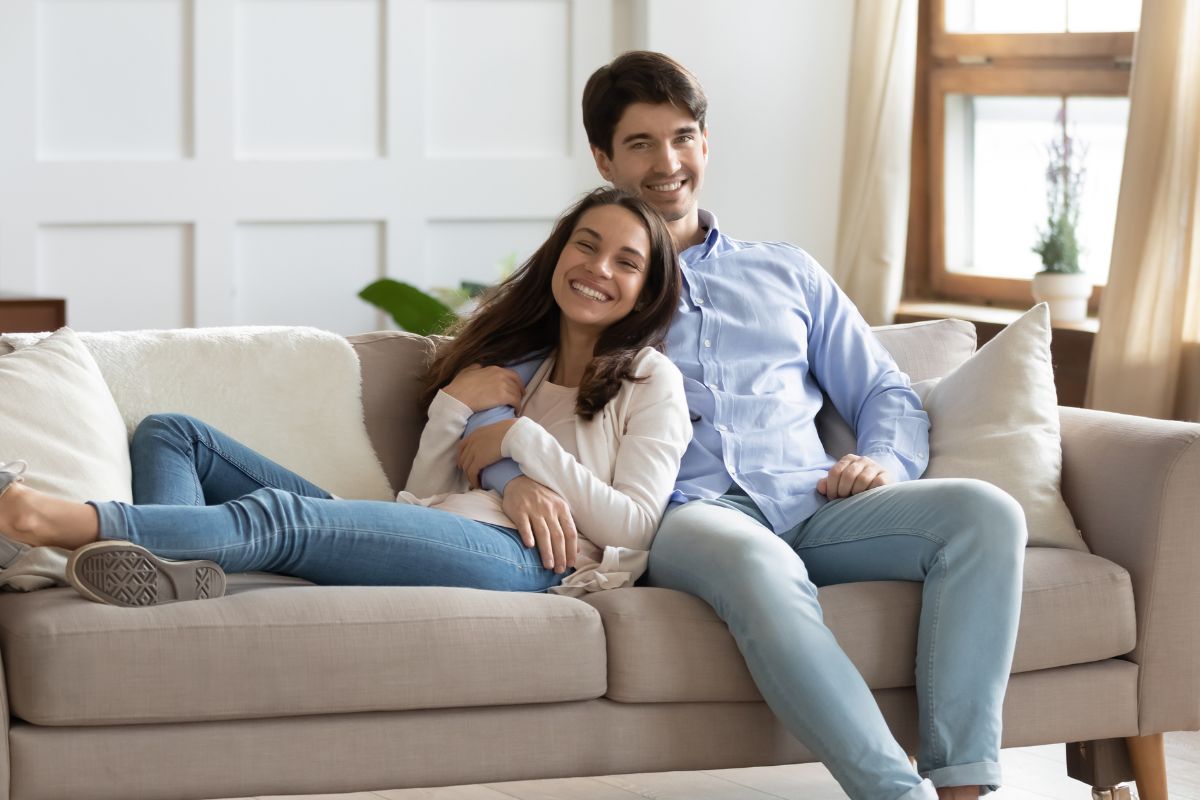 A picture of a couple smiling.