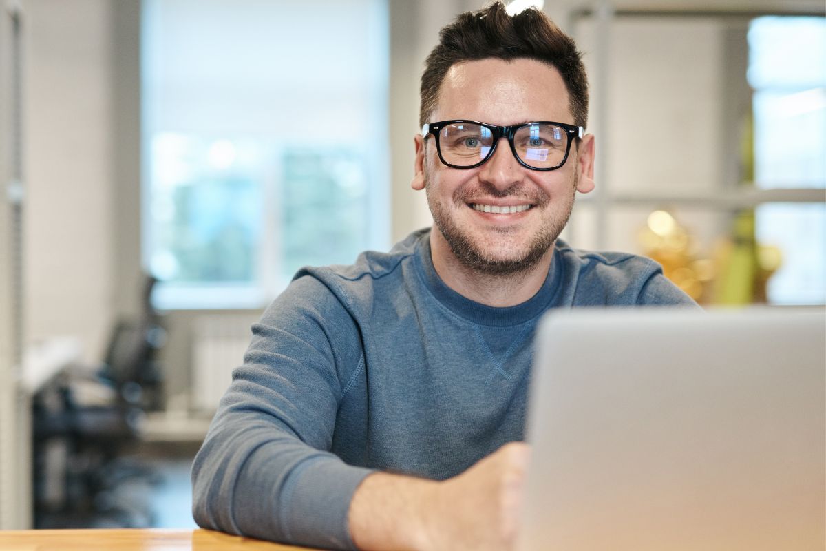 A picture of someone using their laptop.