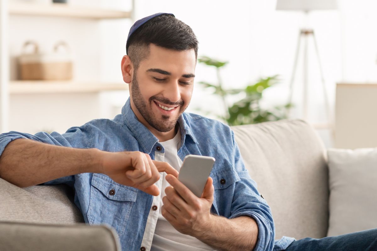 A picture of someone using their phone.